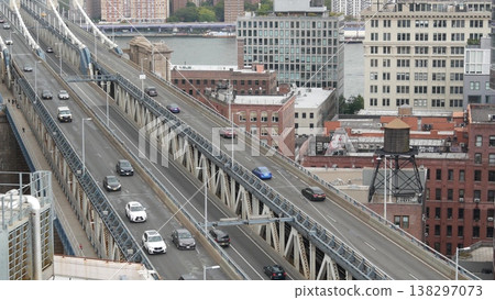 Manhattan bridge from roof in Brooklyn Dumbo, New York USA. City traffic, cars on transport road. 138297073