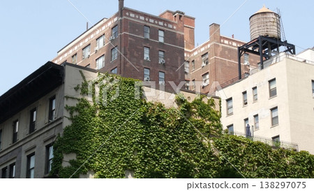 New York City urban building architecture, Manhattan rooftop, USA. Water tower on roof. Water tank. 138297075