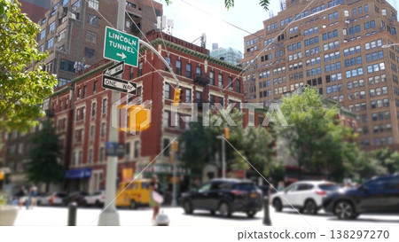 New York City Lincoln Tunnel USA. Manhattan Midtown street. Red brick house. People, yellow taxi car New York City Lincoln Tunnel USA. Manhattan Midtown street. Red brick house. People, yellow taxi car 138297270