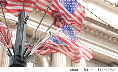 American flags near Grand Central Terminal on 42 street, New York USA. Railway building architecture American flags near Grand Central Terminal on 42 street, New York USA. Railway building architecture 138297292