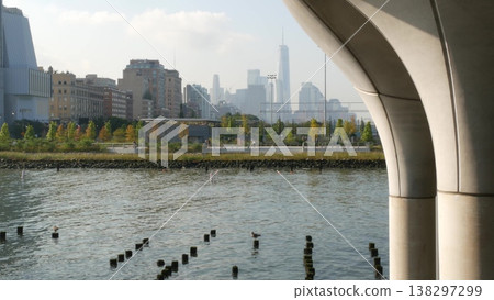 New York City downtown skyline and Little Island pier park in Midtown of Manhattan, United States. New York City downtown skyline and Little Island pier park in Midtown of Manhattan, United States. 138297299