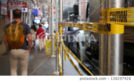Caution yellow tape, construction scaffolding in Manhattan, New York USA. Renovation or maintenance. 138297428