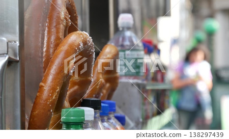 Pretzel for sale, street food in Manhattan, New York USA. Fast food pastry snack on counter or stall Pretzel for sale, street food in Manhattan, New York USA. Fast food pastry snack on counter or stall 138297439