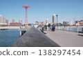 Coney Island beach, wooden pier promenade, Brooklyn, New York, USA. Luna park boardwalk, ocean coast 138297454