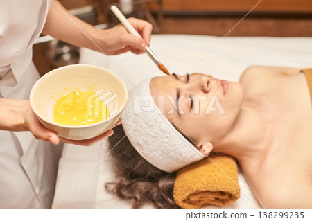 Young Caucasian Female Enjoying Relaxing Spa Facial Treatment With Natural Honey Mask And Soft 138299235