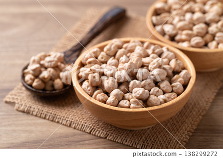 Organic raw chickpeas in a wooden bowl, healthy food ingredient 138299272
