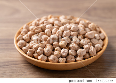 Organic raw chickpeas in a wooden bowl, healthy food ingredient 138299276