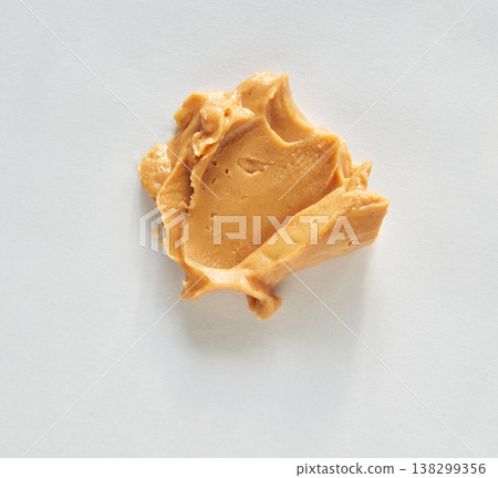 Smooth Peanut Butter Swirl On White Background Creamy Texture And Nutty Flavor Highlighted Smooth Peanut Butter Swirl On White Background Creamy Texture And Nutty Flavor Highlighted 138299356