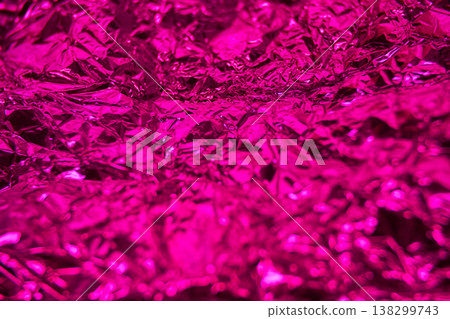 Vibrant crumpled metallic foil texture in shiny pink creases and reflections Vibrant crumpled metallic foil texture in shiny pink creases and reflections 138299743