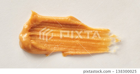 Smooth Creamy Peanut Butter Spread On White Background With Texture Details Highlighted 138300025