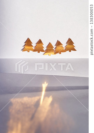 Minimalist Golden Christmas Trees On Reflective Surface With Abstract Shadow Play Minimalist Golden Christmas Trees On Reflective Surface With Abstract Shadow Play 138300053