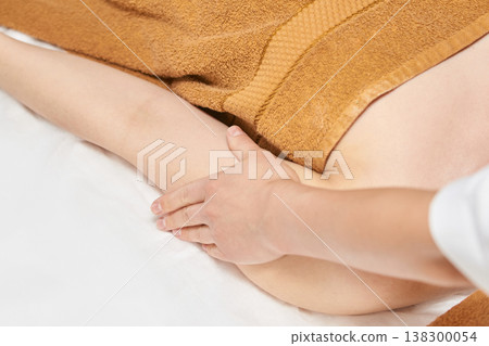 Relaxing Massage Therapy On Young Caucasian Female With Towel In Spa Setting For Wellness 138300054