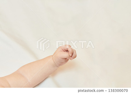 Close-Up Of Caucasian Baby Hand On Soft Fabric In Gentle Light Setting Close-Up Of Caucasian Baby Hand On Soft Fabric In Gentle Light Setting 138300070