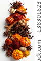 Festive Still Life Featuring Spices Pumpkins and Star Anise on White Background 138301623