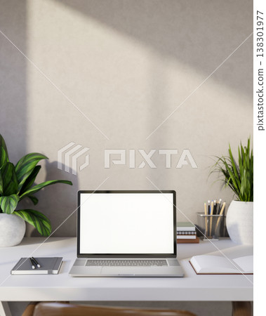 White screen laptop with books and pencils aside potted plant on table with sunlight on room's wall. White screen laptop with books and pencils aside potted plant on table with sunlight on room's wall. 138301977