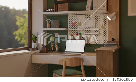 White screen laptop with book and stationery on wooden counter aside glass window in green wall room White screen laptop with book and stationery on wooden counter aside glass window in green wall room 138301990