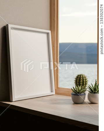 White photo frame an cactus pot on wooden table and river sea view through glass window at home cafe White photo frame an cactus pot on wooden table and river sea view through glass window at home cafe 138302074