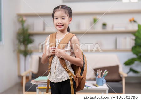 Smiling girl with backpack ready for back-to-school season 138302790