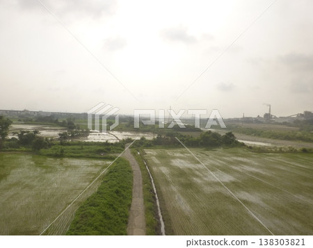Taiwan Taichung - 08.21.2016: Taiwan Historical Scenery: Dajia Riverbank in front of Bianjian Bridge, far away is Houfeng Bridge and Zhenglong Paper Factory Taiwan Taichung - 08.21.2016: Taiwan Historical Scenery: Dajia Riverbank in front of Bianjian Bridge, far away is Houfeng Bridge and Zhenglong Paper Factory 138303821