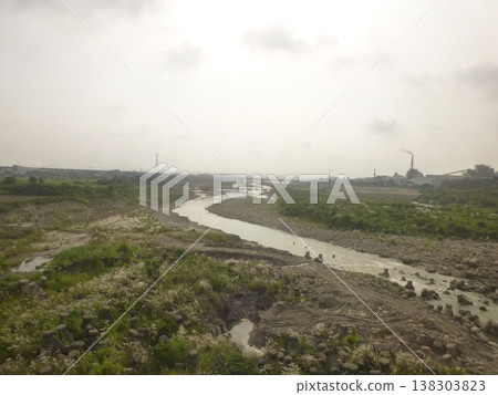 Taiwan Taichung - 08.21.2016: Taiwan Historical Scenery: Dajia Riverbank in front of Bianjian Bridge, far away is Houfeng Bridge and Zhenglong Paper Factory Taiwan Taichung - 08.21.2016: Taiwan Historical Scenery: Dajia Riverbank in front of Bianjian Bridge, far away is Houfeng Bridge and Zhenglong Paper Factory 138303823