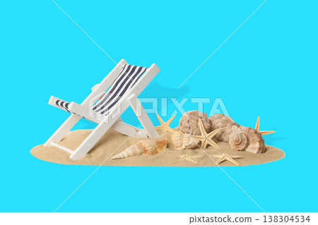 Beach chair rests on sand with seashells and stars nearby Beach chair rests on sand with seashells and stars nearby 138304534