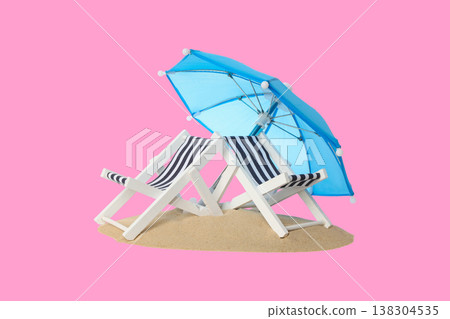 Chairs with striped fabric and blue umbrella on sand Chairs with striped fabric and blue umbrella on sand 138304535