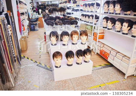 A scene from the exhibition and sale of wigs for the fashion and beauty industry, Shenzhen. A scene from the exhibition and sale of wigs for the fashion and beauty industry, Shenzhen. 138305234