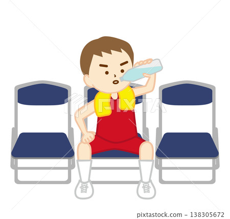 一名籃球運動員坐在折疊椅上補充水分。 一名籃球運動員坐在折疊椅上補充水分。 138305672