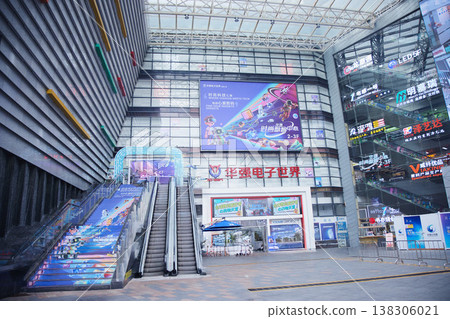 Interior of Huaqiang Electronics World Shopping Mall and escalators in Shenzhen, China, and a high-tech electronics market. Interior of Huaqiang Electronics World Shopping Mall and escalators in Shenzhen, China, and a high-tech electronics market. 138306021