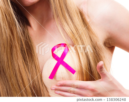 Woman chest in bra, pink cancer ribbon Woman chest in bra, pink cancer ribbon 138306248
