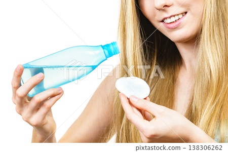 Woman using cleanser cosmetic Woman using cleanser cosmetic 138306262