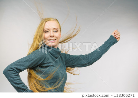 Smiling woman with blowing long hair Smiling woman with blowing long hair 138306271