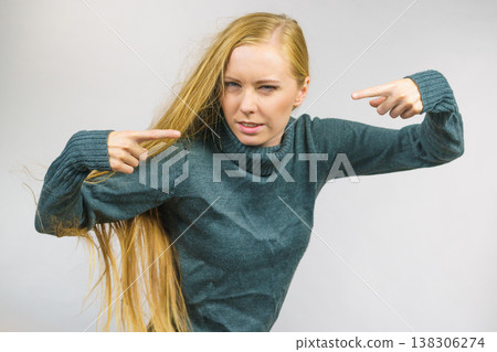 Angry female pointing with fingers Angry female pointing with fingers 138306274