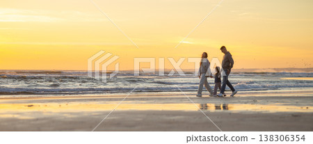 Family walking along beach at golden hour sunset Family walking along beach at golden hour sunset 138306354