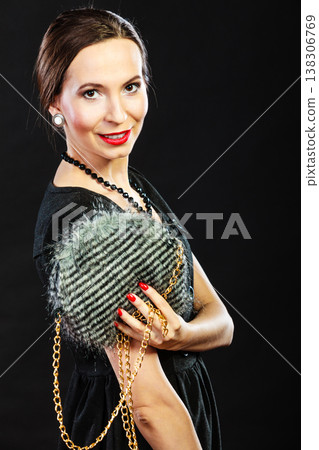 Fashion woman holds handbag Fashion woman holds handbag 138306769