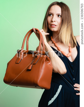 stylish woman fashion girl holding brown handbag stylish woman fashion girl holding brown handbag 138306783