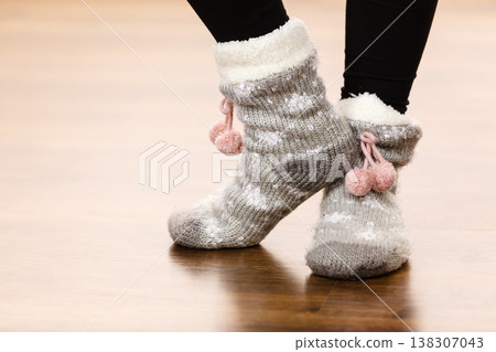 Girl wearing winter warm socks. Girl wearing winter warm socks. 138307043