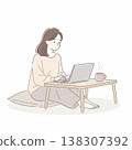 A woman working on a computer at home 138307392