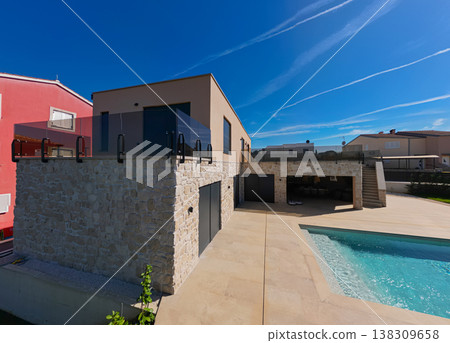 Modular modern smart automated house under construction with finished sections in aerial view Modular modern smart automated house under construction with finished sections in aerial view 138309658
