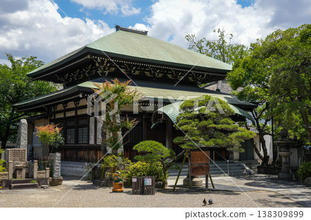 Main building of Isshin-ji Temple surrounded by garden in Osaka, Japan Main building of Isshin-ji Temple surrounded by garden in Osaka, Japan 138309899
