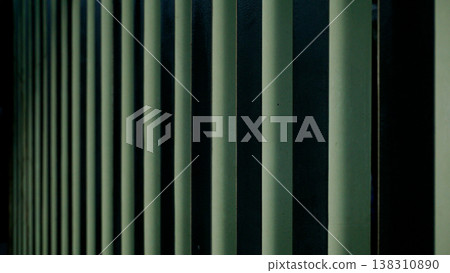 Close up of a green metal blinds on a building wall for design background. Close up of a green metal blinds on a building wall for design background. 138310890