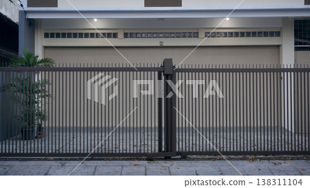 fence in front of a residential building. exterior design for real estate. fence in front of a residential building. exterior design for real estate. 138311104