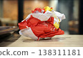 Crumpled red paper on table in coffee shop blur background with bokeh. 138311181