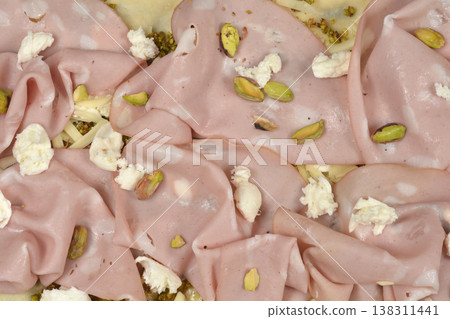 Pizza with mortadella pistachios and mozzarella topping Pizza with mortadella pistachios and mozzarella topping 138311441