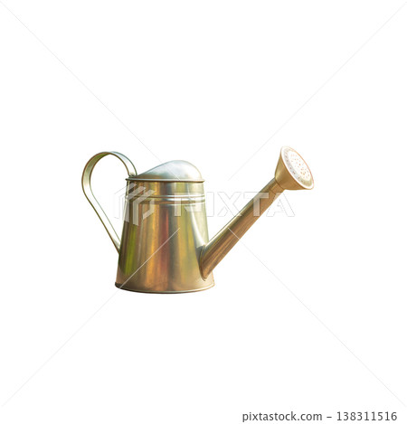 An antique metal watering can on a white background. An antique metal watering can on a white background. 138311516