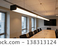 Modern conference room with long table and contemporary linear pendant lighting 138313124
