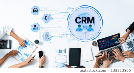 Team Collaboration on Customer Relationship Management with Data Visualization and Analytics on Modern Office Desk Trope 138313500
