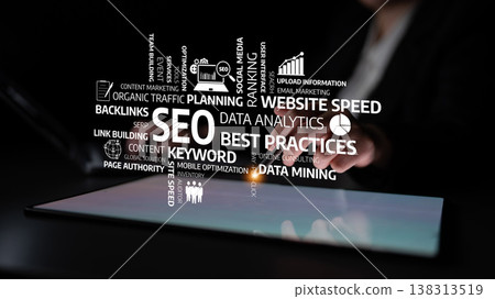 Business Professional Engaging with Digital SEO Elements on Tablet for Website Improvement and Online Marketing Strategies. Tessel Business Professional Engaging with Digital SEO Elements on Tablet for Website Improvement and Online Marketing Strategies. Tessel 138313519