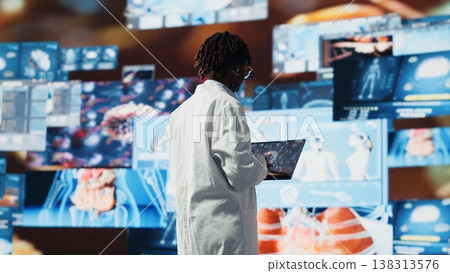 Professional doing scientific research, analyzing virus structure on laptop to support vaccine development. Biomedicine specialist reviewing viral mutation models on notebook using software Professional doing scientific research, analyzing virus structure on laptop to support vaccine development. Biomedicine specialist reviewing viral mutation models on notebook using software 138313576