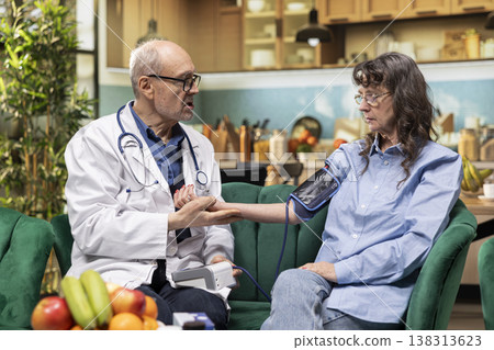 Professional medic, blood pressure monitor, heartbeat and pulse, routine checkup, vital signs, in-home assisted living, medical care. Disease management, BP monitor, gauge and cuff. 138313623
